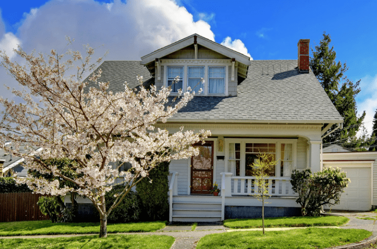House with cherry blossom tree, B&R Tree Service blog for new homeowners, Massachusetts tree service, tree care