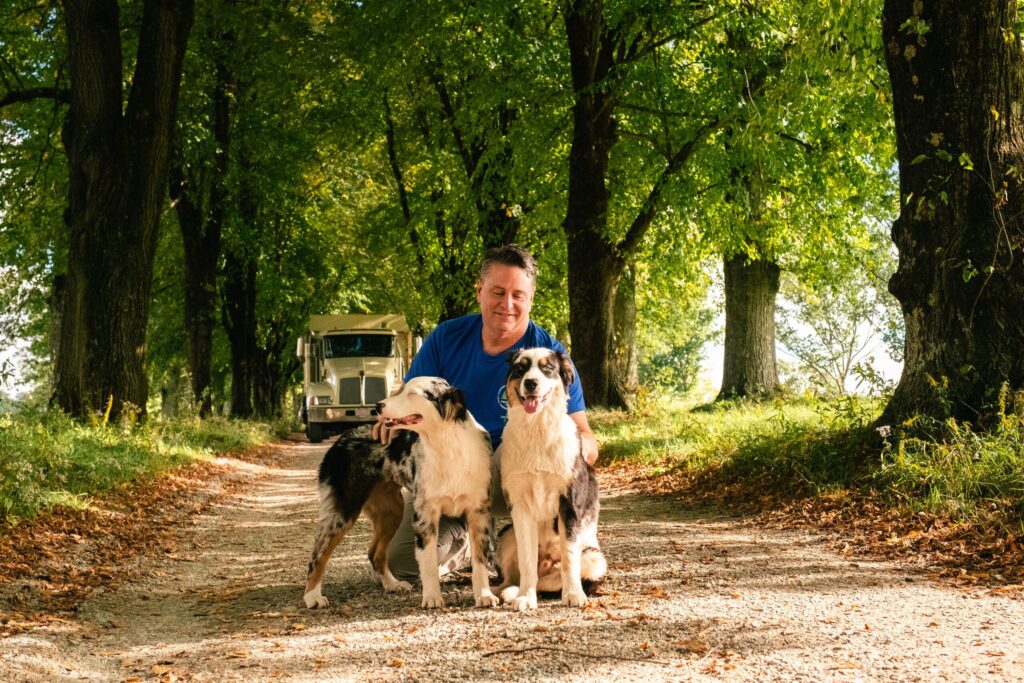 B & R Tree Service Bernie the owner with his two Australian Shepherd dogs